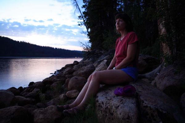 Illuminated by the sky reflected off the lake.
