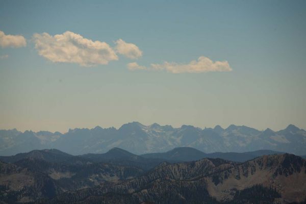 To the south lies Stanley; south southwest, the crest of the Sawtooth is seen through smoke on the horizon.
