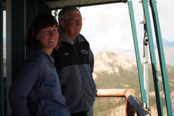 Clayton and Val, shielded from the wind, take in the view to the southeast.
