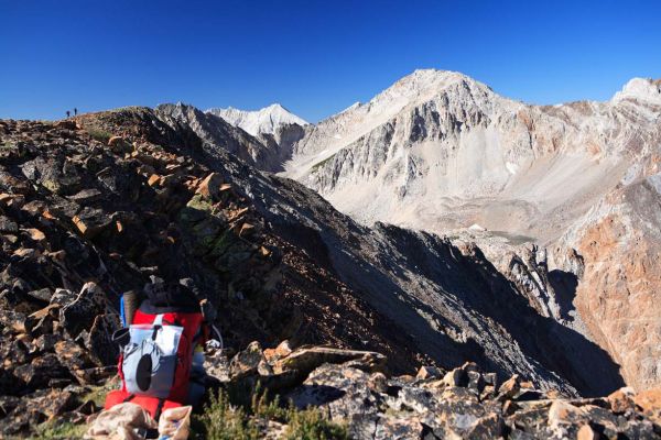 Gunsight Lake lined up in the Gunsight.  D.O. Lee Peak rises majestically in the distance differentiated by white limestone deposits.
