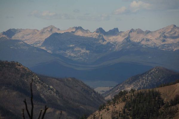 Across the Sawtooth Valley, central in the image, Finger of Fate stands in the shadow of a cloud below the crest.  Decker Peak is on the far right.
