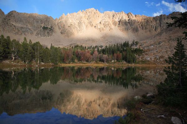 The sun highlights the ridge through the clouds northeast of lake 9555 in the upper Born Lakes Basin.
