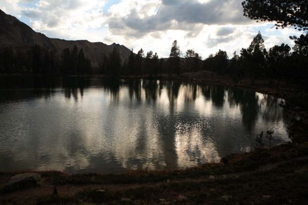 To the southwest, evening clouds reflected in lake 9555; upper Born Lakes Basin.
