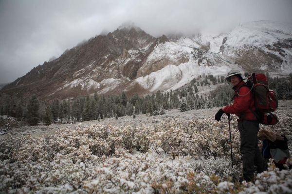 Castle Peak shrouded in storm clouds above Lake 9197; Lower Chamberlain Basin.
