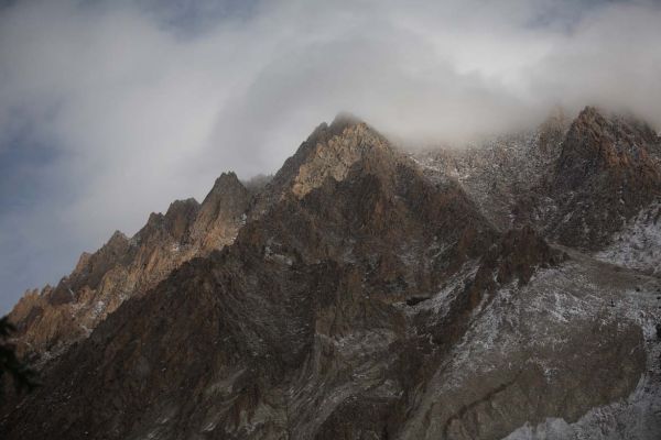 Upper ramparts of Castle Peak hidden in clearing storm clouds.
