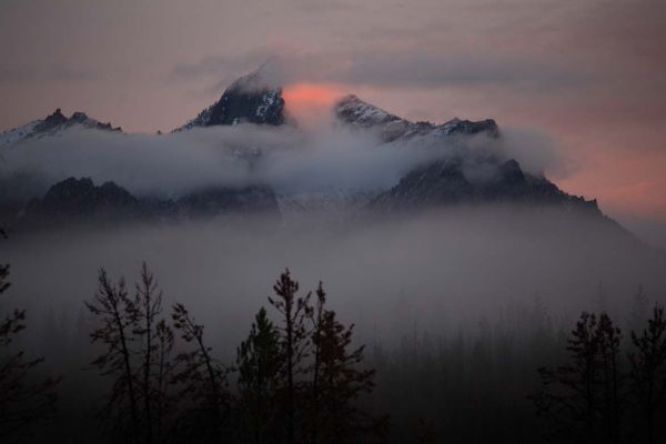 Convective fog in front of McGown Peak backlit by setting sun; southwest of Park Creek Overlook.
