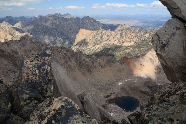 North from the Summit, sunlight highlights the pink granite Elephant's Perch.  Rising directly above and behind are the peaks Goat Perch to Redfish Point on the right.
