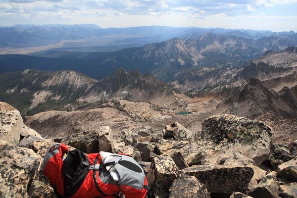 Southeast from the summit, Finger of Fate rises in shadow from just above the center on the far right.  The lakelet at 8607' is seen just below the center on the far left.
