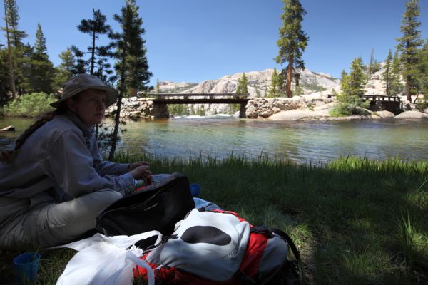 Snack break at the foot bridge above Tuolumne Falls on the PCT.
