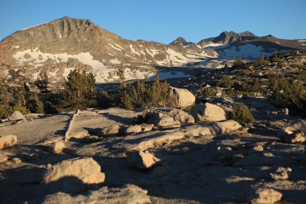 In keeping with our late start, we stop late, deciding to camp on the saddle separating the Lyell Canyon and Merced River drainages, at 10585'.  We took advantage of shade in the cooler part of the day to do our climbing.  There are few mosquitoes in this drier exposed plateau, and there is water close by.  The Professor is exhausted, so I run back to down the trail to get water from melting snow banks to prepare dinner.
