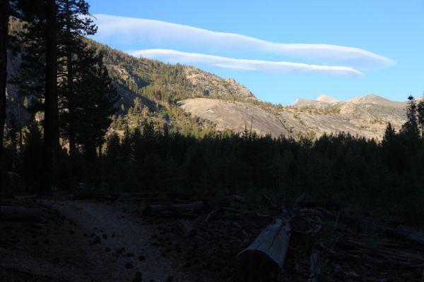 At 8:20 pm we opt to continue past Echo Canyon, entering a section where the trail crosses open granite slopes high above the Merced River in the narrow canyon below.  Lenticular clouds appear to the northwest.  The plan is to reach good camping below the footbridge just above Bunnell Cascade.
