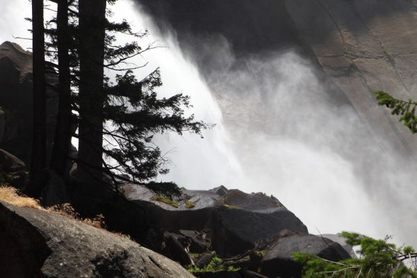 Couds of water bathe the granite apron at the bottom of Nevada Falls.
