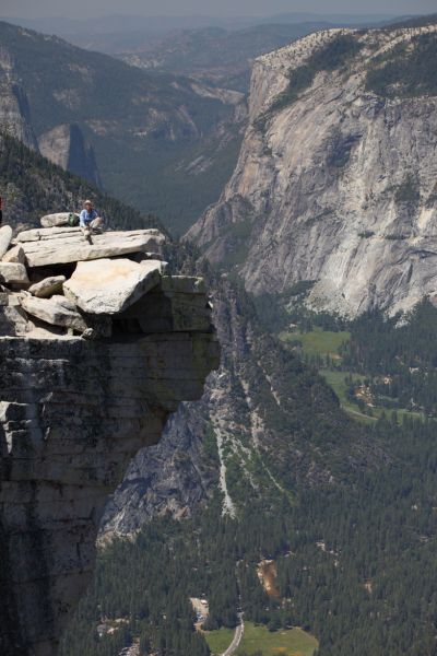 The Professor has a moment of solitude on the prow of Half Dome overlooking Yosemite Valley.
