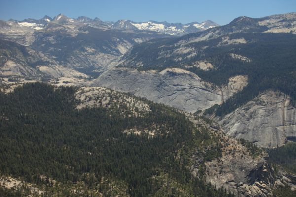 East, from the summit of Half Dome, snow-covered Banner Peak is the first significant summit from the left with the prominent snowfield high on its north face.  Two days earlier, we passed through much of the northeast trending drainage in the foreground which rises to Tuolumne Pass, before dropping into Lyell Canyon where we began our loop.
