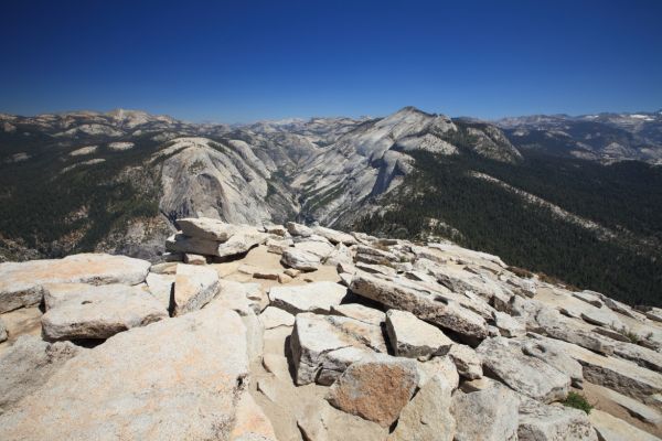 16mm wide angle view from the summit of Half Dome up Tenaya Canyon, past the domes above Tenaya Lake, to Mt. Conness, 20 miles distant.
