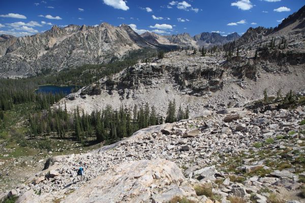 Looking southeast above Alpine Lake, ascending to the saddle just northeast of Peak 9769.
