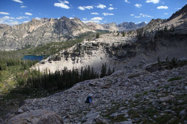 Looking southeast above Alpine Lake, ascending to the saddle just northeast of Peak 9769.
