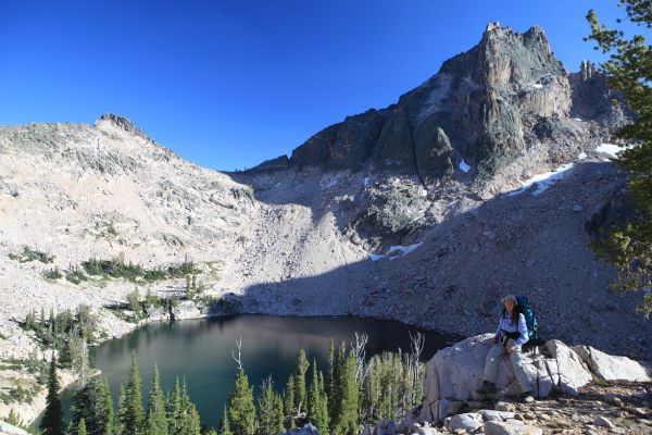 Packrat Peak looms above Warbonnet Lake.
