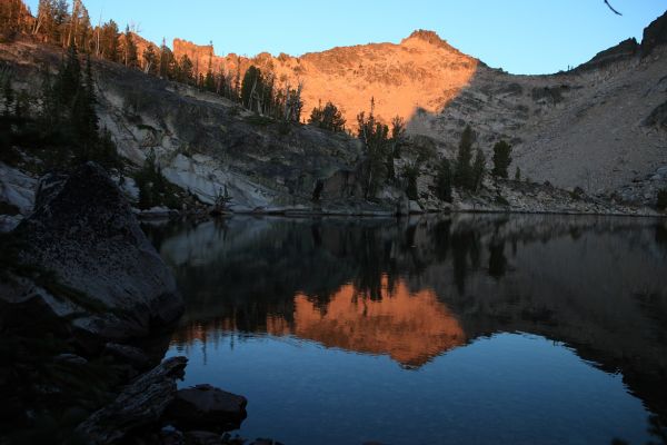 Packrat Peak in the last rays of evening light above Warbonnet Lake.
