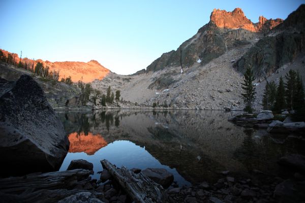 The last rays of light on Packrat Peak and Mayan Temple reflected in Warbonnet Lake.
