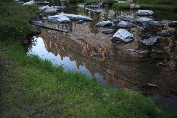 Monte Verita ridge reflected in stream meandering toward Feather Lakes.
