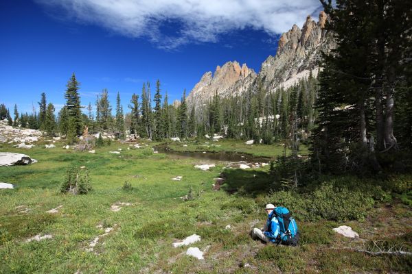 Elisa relaxing in Meadow below Warbonnet Peak.
