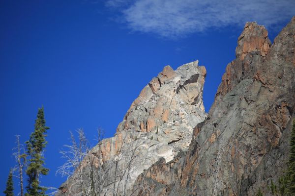 A party of 3 climbers can be seen descending the face of Warbonnet peak in the following photos if the images are magnified.
