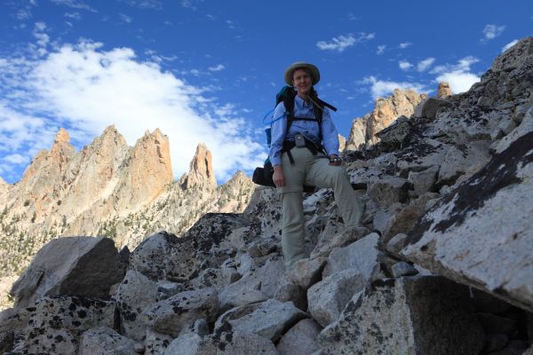 Elisa nearing the end of boulder hopping below Blue Rock Butress, high above Blue Rock Lake; a slightly lower route descending further down the granite slabs might have avoided the short section of boulders.  See photos in Warbonnet Lakes Basin, August 11-12, 2007 gallery.
