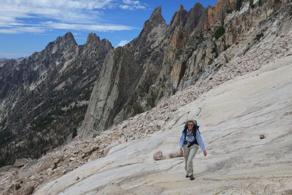 Elisa climbs the friction highway, not to be confused with the feature of the same name on Warbonnet Peak rising in the distance.  The slabs are a great relief from the tedious, albeit minimal, boulder hopping.
