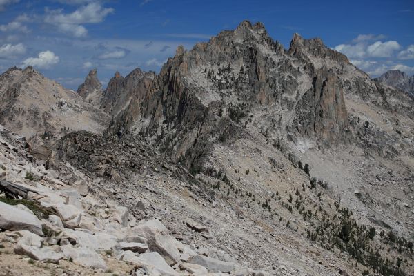 The east face of Mount Underhill (II, 5.1) above Upper Redfish Lakes from the saddle north of Reward Peak.  Packrat Peak is the next summit right.
