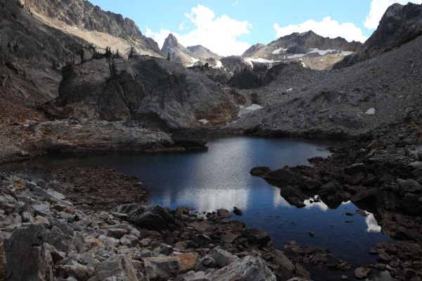 The first tarn in the basins above Goat Lake.  Thompson Peak looms closer.
