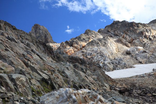 Near the top of the broad chute leading to the basin, Thompson Peak always looming above.
