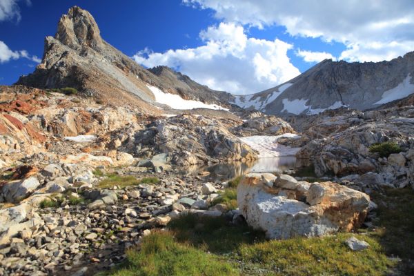 To the left (east), on the other side of the ridge in the foreground coming down from Thompson is the "unnamed lake" at 9033'.
