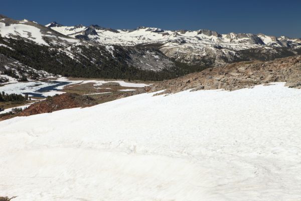 Mount McClure comes into view (dark peak, snow on left skyline above lake) looms over Lyell Canyon where the Pacific Crest Trail enters Yosemite from the south.
