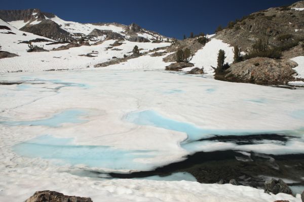 Staying high to the west on the butress, we avoided steeper sections further north, descending to this mostly frozen lake south of Spuller Lake. 
