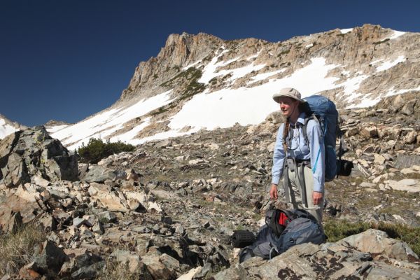 The route climbs north to a saddle on the east ridge of Mount Conness overlooking a steep droppoff to Greenstone Lake.
