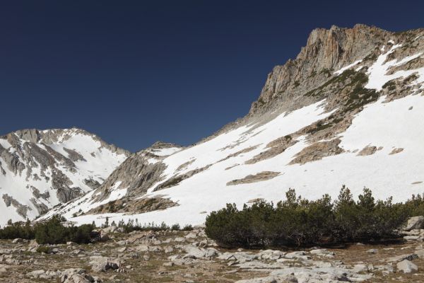 The south side of the east ridge of Mount Conness towers over an extensive flat area at about 10,900'.
