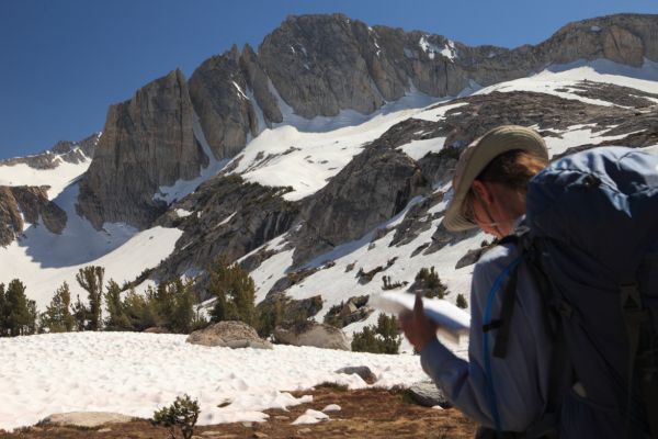 The Professor consults the map.  The North Peak rises to the south.
