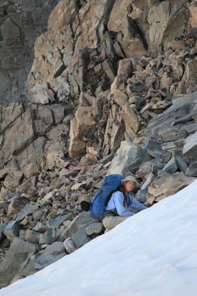 The Professor makes her way to the top of Sky Pilot Col, utilizing the rock snow interface.  Fortunately, the snow, already in shadow, was still soft.
