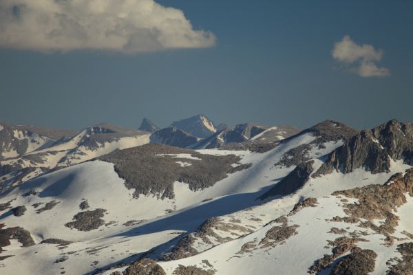 From Sky Pilot Col, Mt. Ritter (in center with snowfield on northwest face) rises 23 miles to the south.  Immediately to the left is the sharp horn of Banner Peak.
