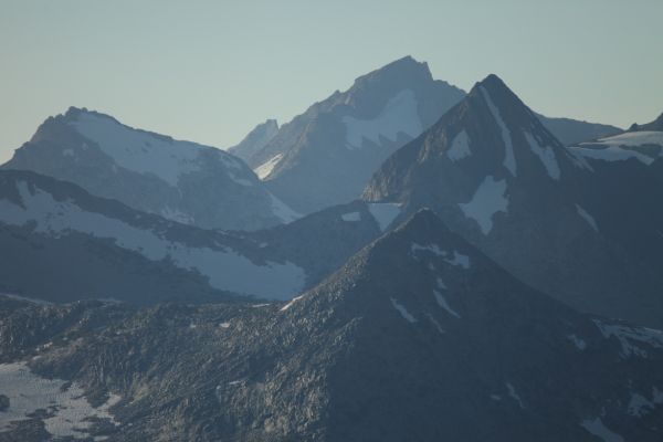 Matterhorn Peak and the Sawtooth Ridge extending NW from it (center, skyline) in hazy, early evening backlight, to the northwest from Sky Pilot Col.  Virginia Peak, with its long, thin, vertical snow couloir is most prominent just right of center.  Whorl Mountain is on the left skyline.  This view is from a perspective 2.7 miles south southwest of that taken in IMG_5853 on page 1.
