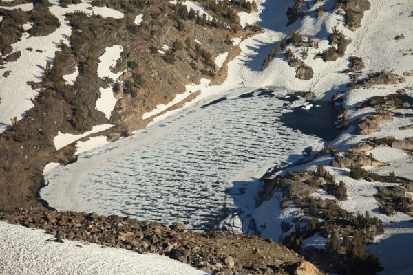 Cascade Lake at 10318', still partially frozen on July 22, in this 2011 record snow year; south southeast from Sky Pilot Col.
