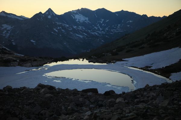 Just above Shepherd Lake, losing the light at 9:10 pm.  The descent has been on steep snowfields for the most part, and the Professor is getting a crash course on negotiating this kind of terrain with a heavy pack.
