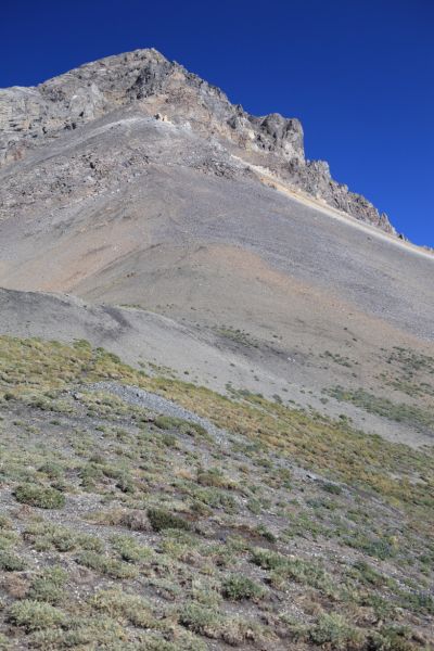 Talus-plagued west ridge of Leatherman Peak rises from the pass.
