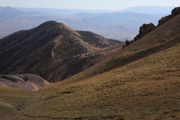 Southwest of Leatherman Pass, the Boulder Mountains can be seen on the horizon just right of center beyond the Pioneer Mountains.  The Sawtooth Range is on the distant horizon at the top right.
