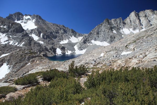 Tarn at 12195' above and east of Echo Lake.  The preferred xc route over the crest to Evolution Valley is 3rd class Echo Col to the left (southeast) of Clyde Spires.  We opted for 2nd class Wallace Col southeast of Mt. Wallace, around the ridge in right foreground, and to the right.
