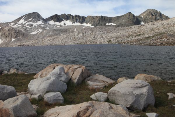 Mt. Goddard on the far right (west) rising above Wanda Lake.  Starr's Route (class 2) ascends the north ridge of the dark peak to the left (east), to its crest, then a ledge leads around behind this peak (12980+) to the top of the Goddard Divide.  Ascend talus slopes to the summit of Mt. Goddard.
