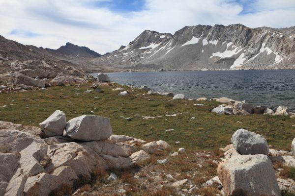 The western flank of the Goddard Divide leads to the left (east) all the way to Muir Pass, the low spot visible about 1/3 from the left edge of frame.  Mt. Solomons is just south of the eastern end of the Divide, visible in the center on the skyline.
