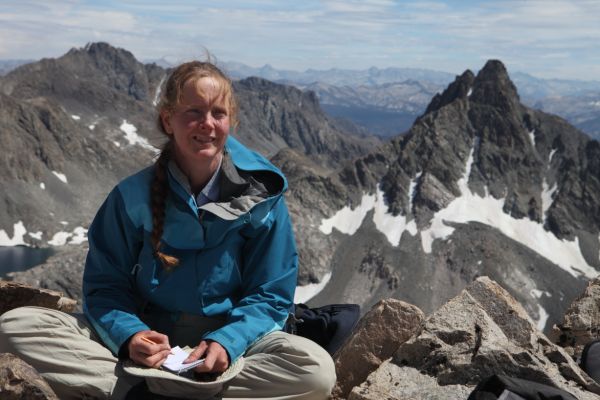 The professor makes an entry in the summit register; her second summit, and first Sierra peak!
