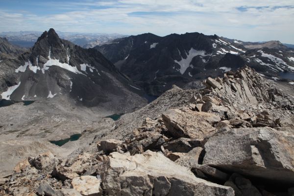 South from the summit of Mt. Solomons, the entrance to the not so 'Enchanted Gorge' through the "dark gate" guarded by Scylla and Charybdis, beyond Chasm Lake in the center of the photo.  Scylla rises above Chasm Lake to the south.  The gorge descends over 5000' down Disappearing Creek southeast to Goddard Creek, to the Middle Fork Kings.
